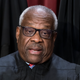 Associate Justice Clarence Thomas joins other members of the Supreme Court as they pose for a new group portrait, at the Supreme Court building in Washington, Friday, Oct. 7, 2022.